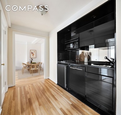 Open western city views highlight this bright corner one-bedroom - photo 3