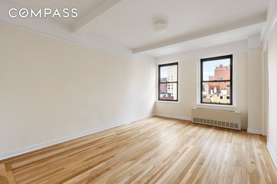 Open western city views highlight this bright corner one-bedroom - photo 8