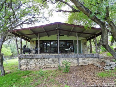 CUTE 1/1 COUNTRY ROCK HOUSE ON THE WATERFRONT OF  PLUM COVE - Lake Home For Sale in Lakehills, Texas