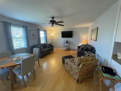 This inviting second-floor condo in Westhampton offers a - photo 2