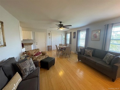 This inviting second-floor condo in Westhampton offers a - photo 3