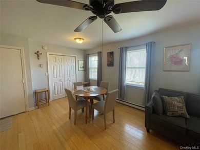 This inviting second-floor condo in Westhampton offers a - photo 4