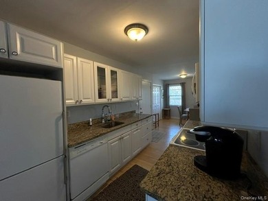 This inviting second-floor condo in Westhampton offers a - photo 7