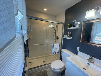 This inviting second-floor condo in Westhampton offers a - photo 10