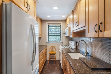 Experience top-floor privacy in this beautifully maintained - photo 6