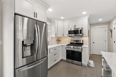 This beautifully renovated Colonial in East Islip sits on an - photo 5