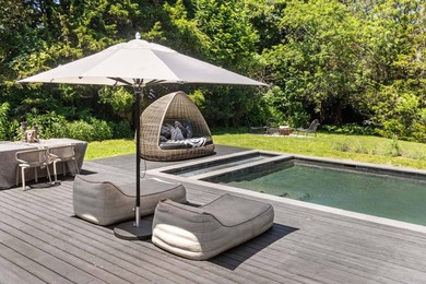 Discover a private Hamptons sanctuary where modern luxury meets - photo 31