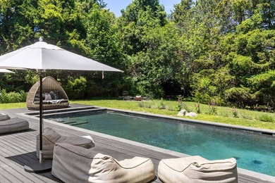Discover a private Hamptons sanctuary where modern luxury meets - photo 32