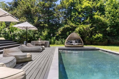 Discover a private Hamptons sanctuary where modern luxury meets - photo 34