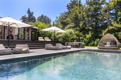 Discover a private Hamptons sanctuary where modern luxury meets - photo 35