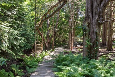 Discover a private Hamptons sanctuary where modern luxury meets - photo 39
