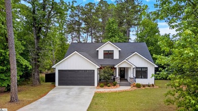 An oversized covered front porch with stained wood ceilings sets - photo 2