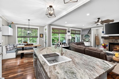 An oversized covered front porch with stained wood ceilings sets - photo 8