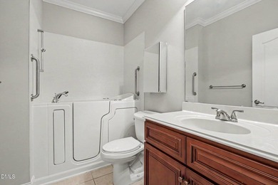 Beautiful brick ranch with custom moldings, tray ceilings, and a - photo 22