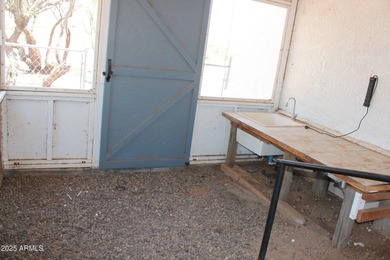 What a find...stucco 4BR/2BA home on 4 acres...covered front