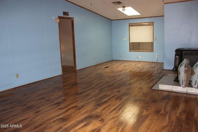 What a find...stucco 4BR/2BA home on 4 acres...covered front