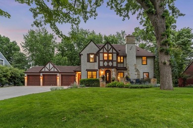 This exceptional 1928 Tudor is nestled in the sought-after - photo 1