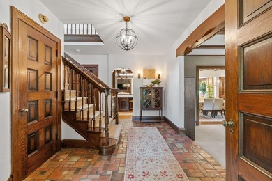 This exceptional 1928 Tudor is nestled in the sought-after - photo 3