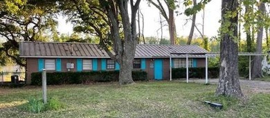This charming 3-bedroom, 2-bath camp offers the ideal blend of - photo 1