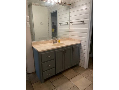 This charming 3-bedroom, 2-bath camp offers the ideal blend of - photo 4