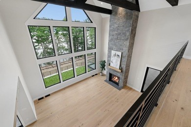 Perched high above the shimmering waters of Lake Winnisquam in - photo 11
