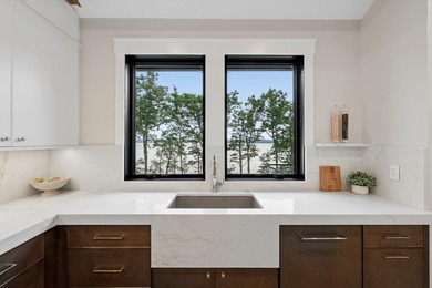 Perched high above the shimmering waters of Lake Winnisquam in - photo 19