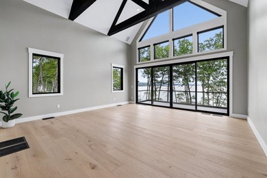 Perched high above the shimmering waters of Lake Winnisquam in - photo 30