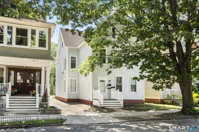 This East Rock three-family has been completely rebuilt within