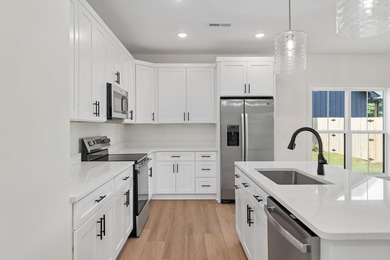 Welcome to this charming cottage-style new construction in the - photo 16