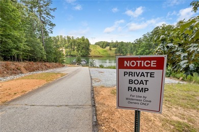 Tucked inside the gated community of Wilderness Cove on Lake - photo 2
