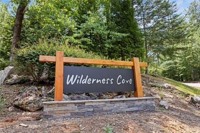 Tucked inside the gated community of Wilderness Cove on Lake - photo 4