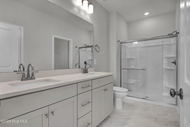 This spacious townhome boasts a first-floor primary suite, and - photo 38