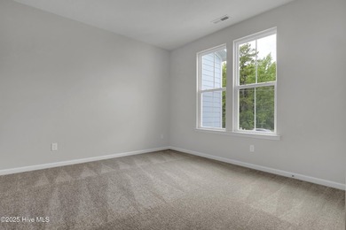 This spacious townhome boasts a first-floor primary suite, and - photo 42