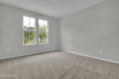 This spacious townhome boasts a first-floor primary suite, and - photo 44