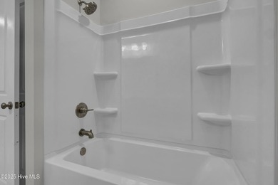This spacious townhome boasts a first-floor primary suite, and - photo 46
