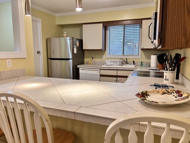 Experience waterfront living at The Palms of Sunset Harbor on - photo 8