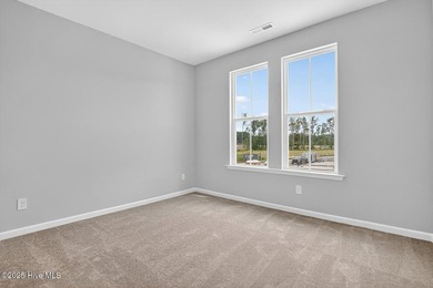 This spacious townhome boasts a first-floor primary suite, and - photo 31