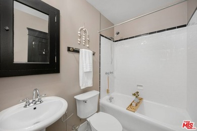 Sun-drenched and full of charm, this beautifully maintained - photo 13