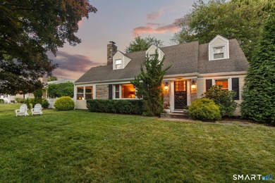 This classic New England Cape Cod is nestled just a short walk - photo 1