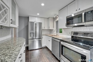 Beautifully updated and deceptively spacious, this move-in ready - photo 6