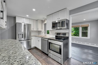 Beautifully updated and deceptively spacious, this move-in ready - photo 8