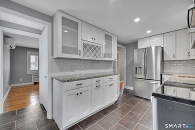 Beautifully updated and deceptively spacious, this move-in ready - photo 9