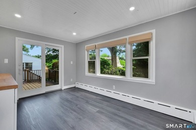 Beautifully updated and deceptively spacious, this move-in ready - photo 10