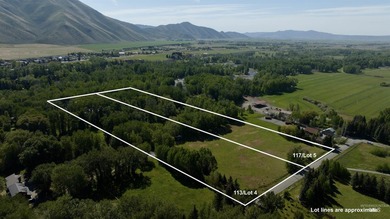 Explore this rare 14-acre riverfront property spanning both - photo 1