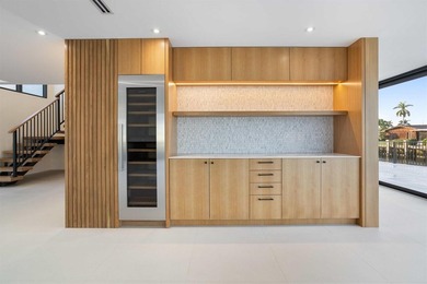 Experience luxury waterfront living in this extensively - photo 26