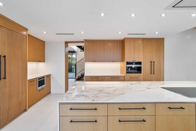 Experience luxury waterfront living in this extensively - photo 35