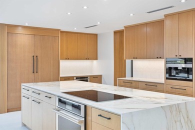 Experience luxury waterfront living in this extensively - photo 40