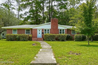 Step into the charm and character of this classic brick-front - photo 1