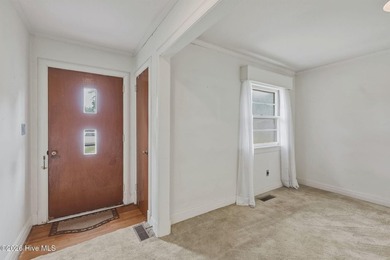 Step into the charm and character of this classic brick-front - photo 3