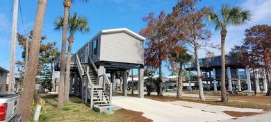 Welcome to effortless waterfront living in the peaceful, golf - photo 2